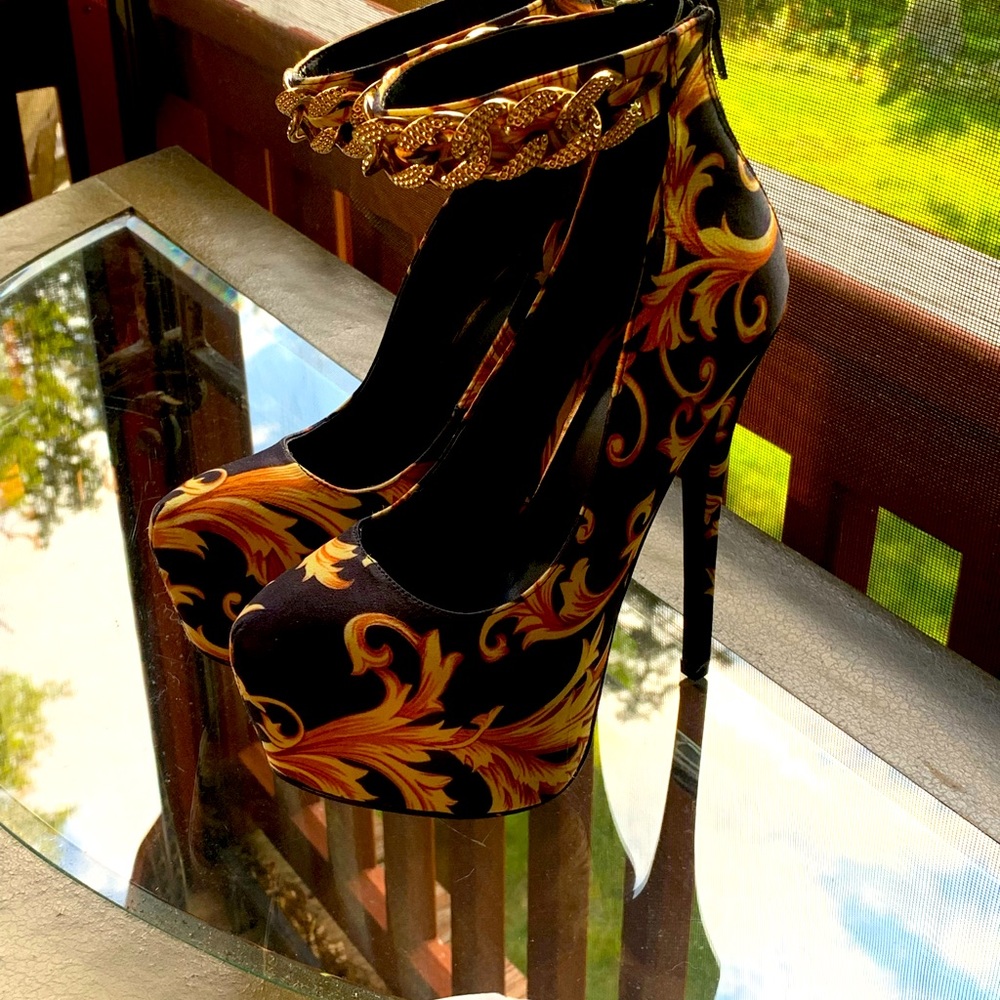 Gold and black platform stilettos